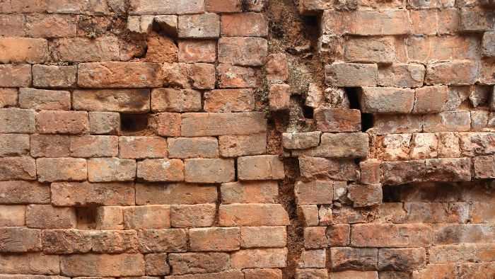 Brick wall with giant crack running through the center