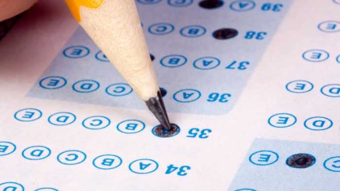 Pencil filling out a scantron test