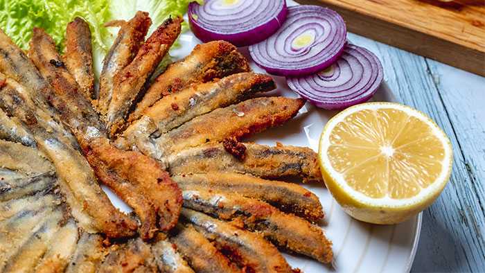 Plate full of gross looking fried fish