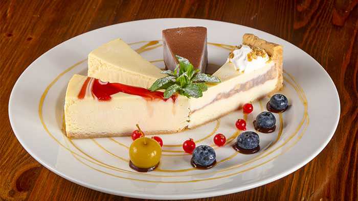 Cheesecake-laden plate on wooden table