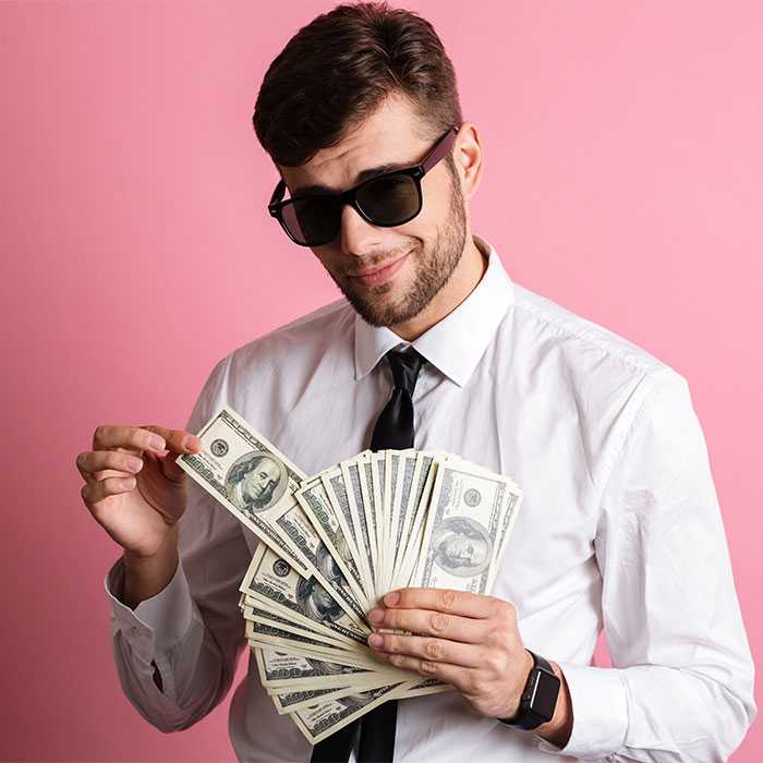 Student in suit and cool shades smugly counts money