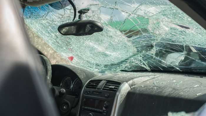 view from inside car with broken window insinuating accident