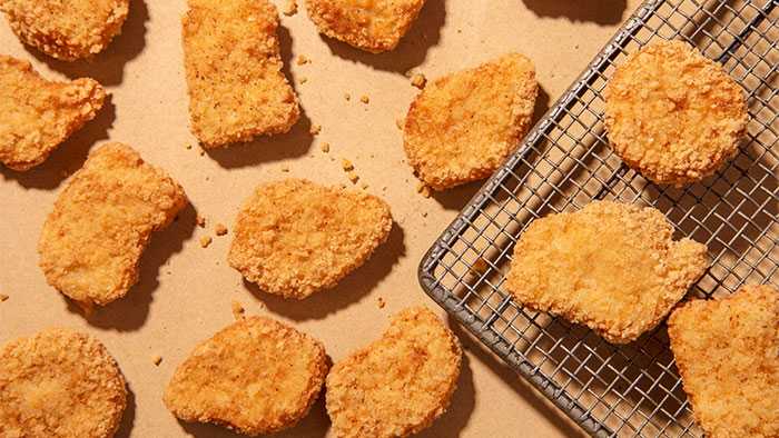 Chicken nuggets scattered across table top