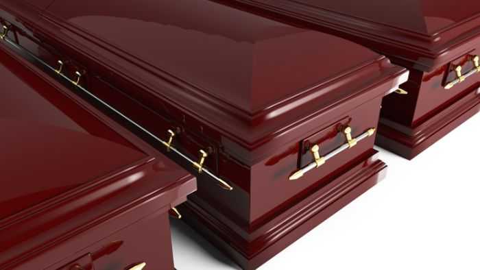Row of three coffins