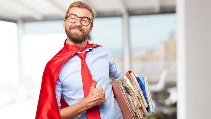 lame manager carrying a bunch of files and wearing a cape and being too happy