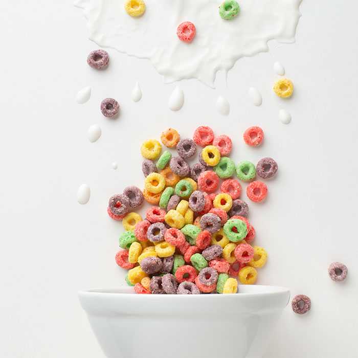 Cereal and milk splashing out of bowl
